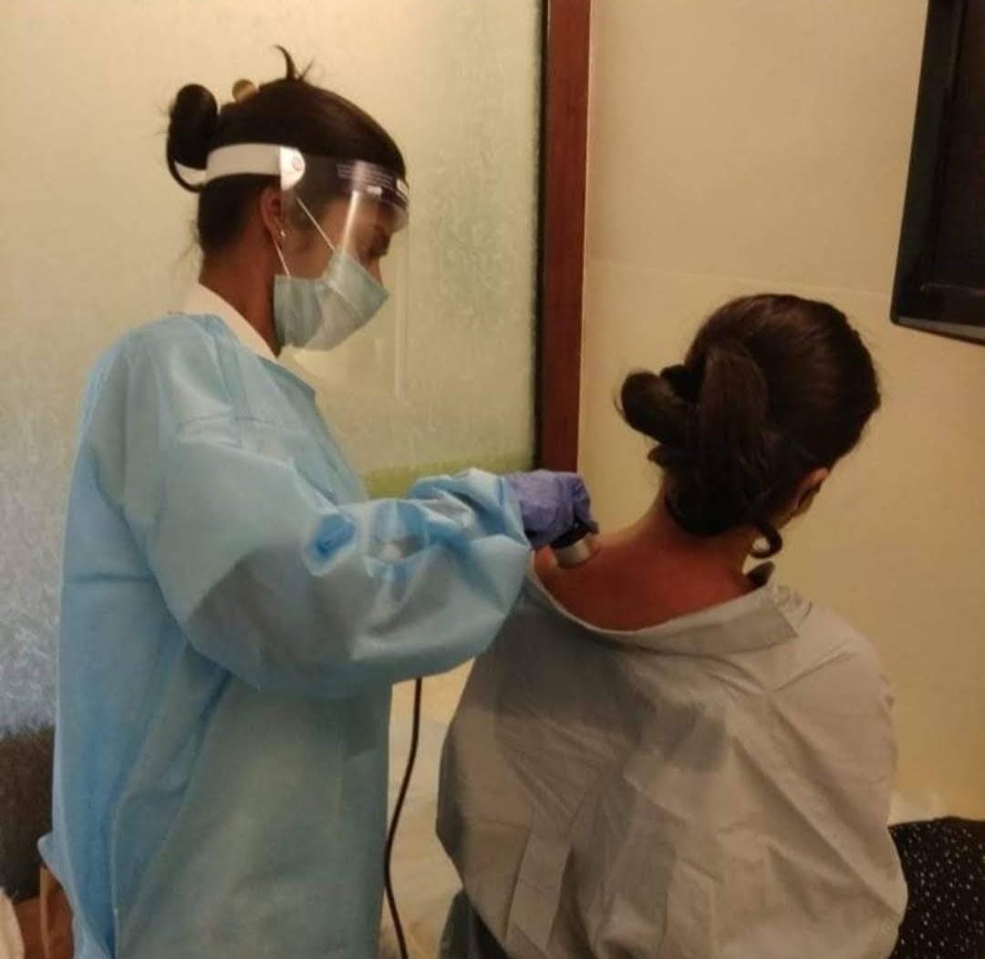 Dr. Sneha providing a physiotherapy treatment session